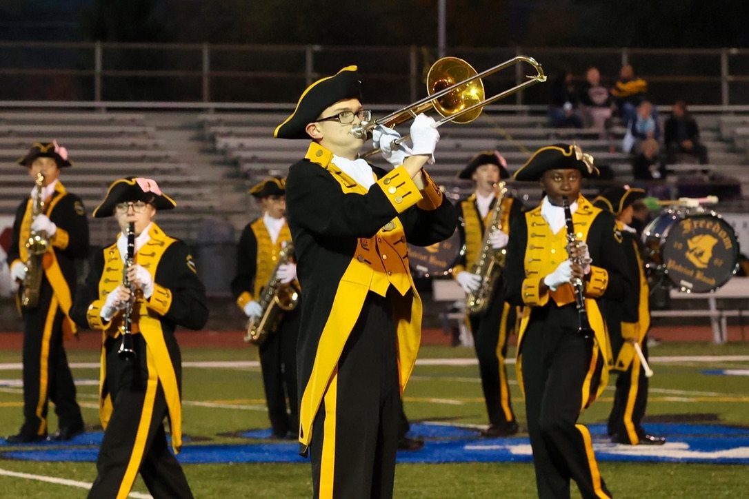 Playing trombone during a high school football halftime show