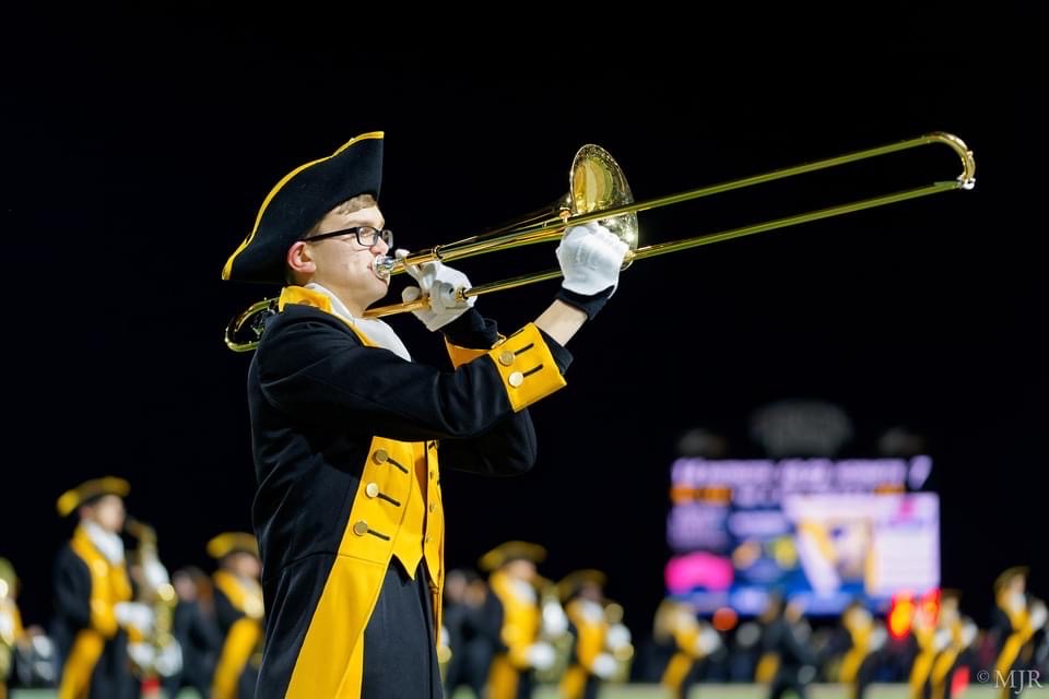 Playing trombone during a high school football halftime show